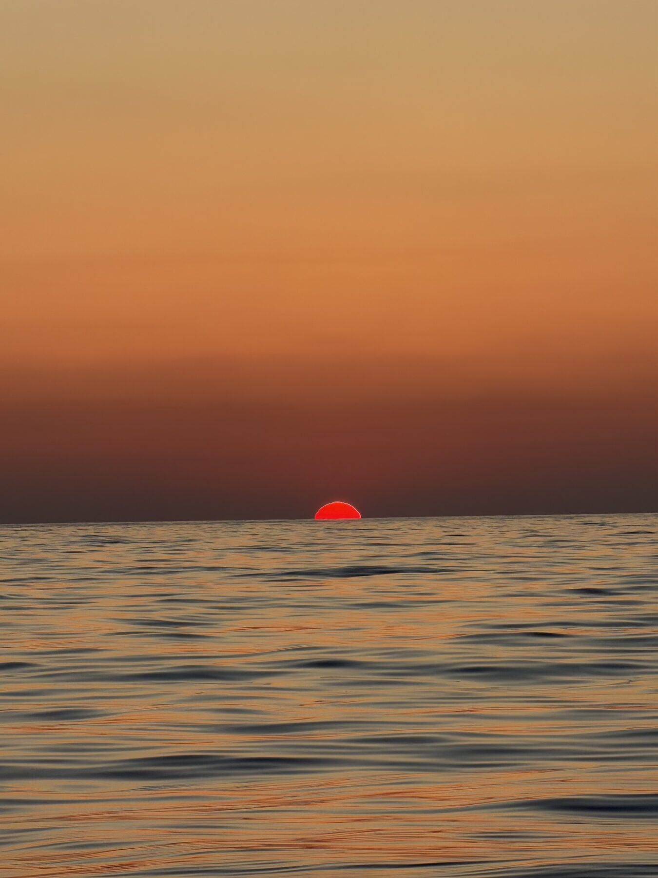 The sun melting into the Mediterranean off Pafos, seen from SharaBADanga